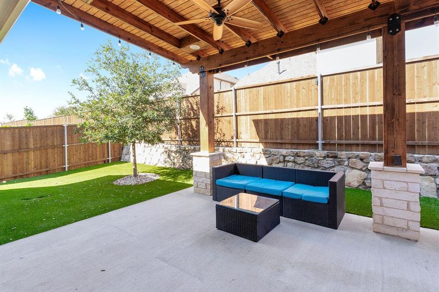 View of patio featuring ceiling fan