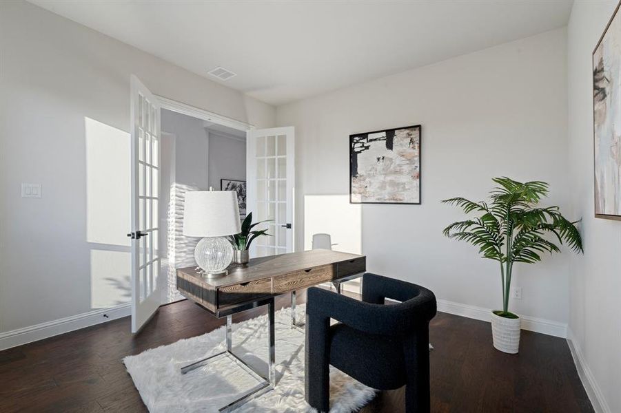 Office area featuring french doors and dark hardwood / wood-style floors