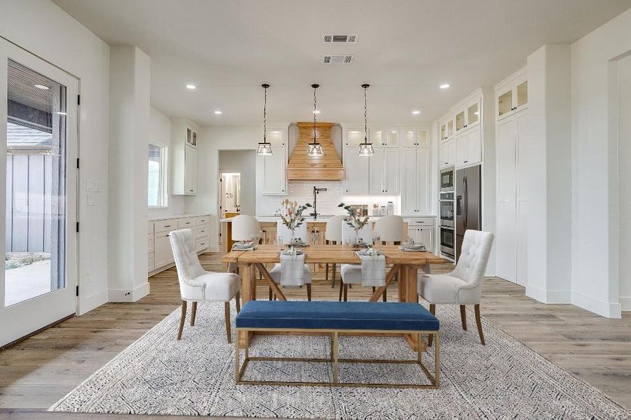 Dining area with light hardwood / wood-style floors