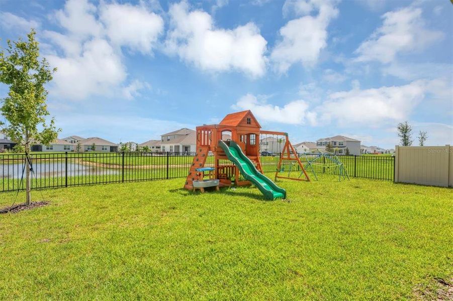 Wooden playset in the yard is perfect for the kids!