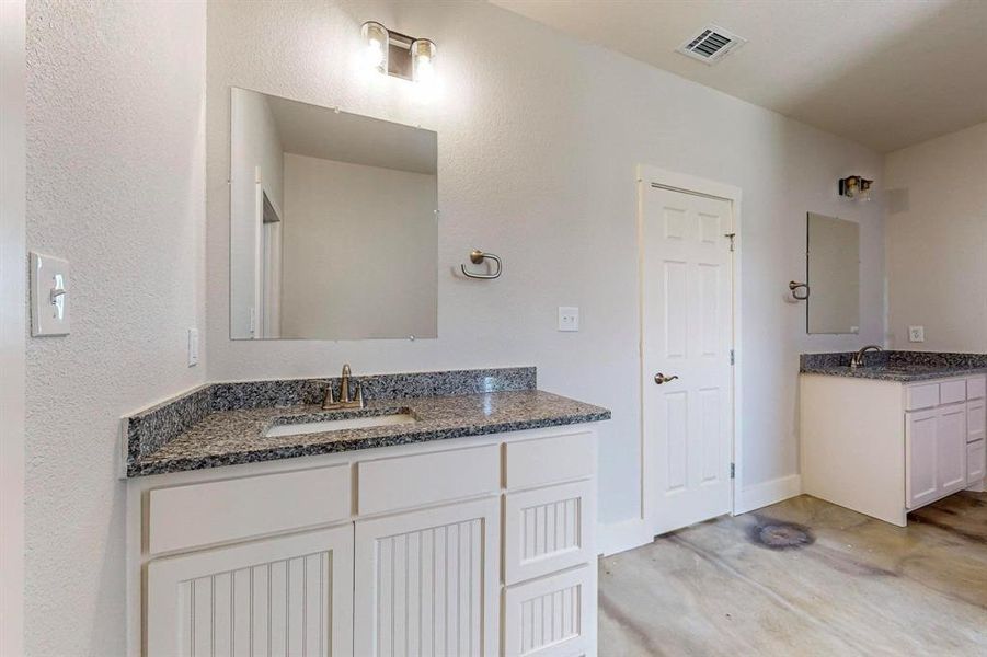 Bathroom featuring dual vanity