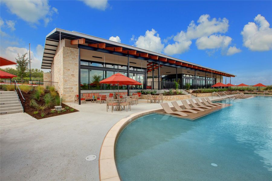 A resort-style pool with beach entry, tanning ledges and plenty of shaded seating offers a retreat from the summer heat.