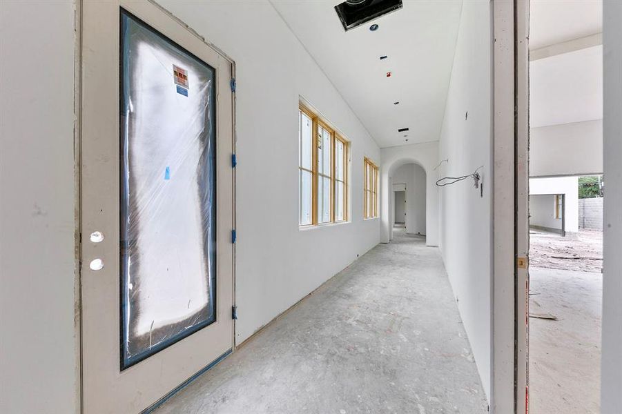 Hand selected marble floors will be featured in this hallway along with white oak beams on the ceiling.