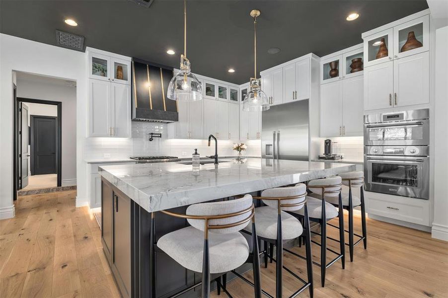 Chef's kitchen with Quartzite countertops and stainless steel appliances