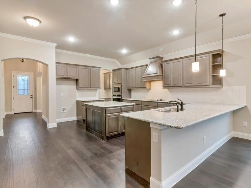 Kitchen | Concept 2533 at Abe's Landing in Granbury, TX by Landsea Homes