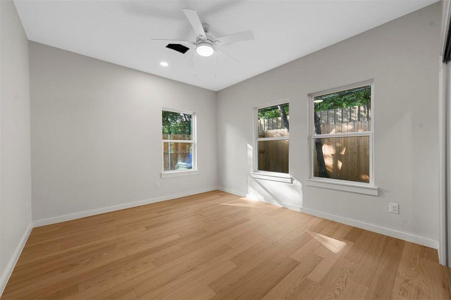 Spare room with light hardwood / wood-style floors and ceiling fan