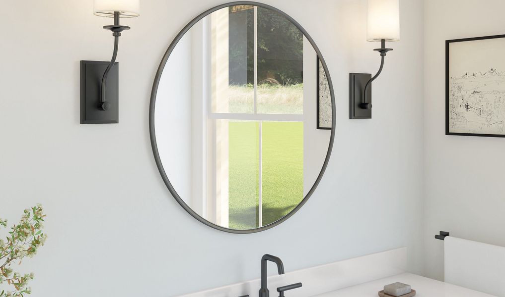 Black framed mirror & chrome faucet in primary