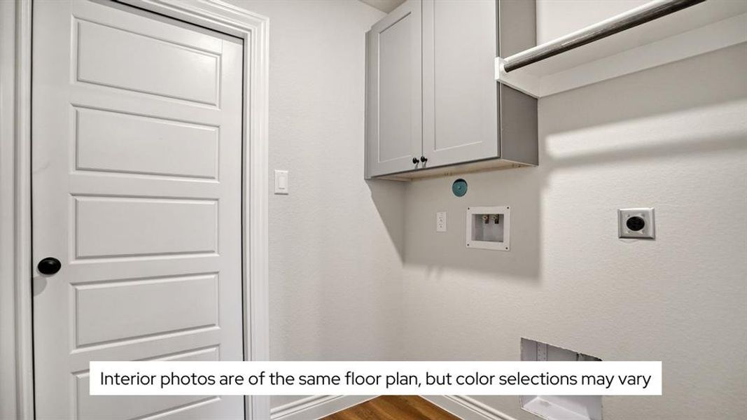 The utility room features cabinets, a hanging rod, and lights on an occupancy sensor to save on electricity.