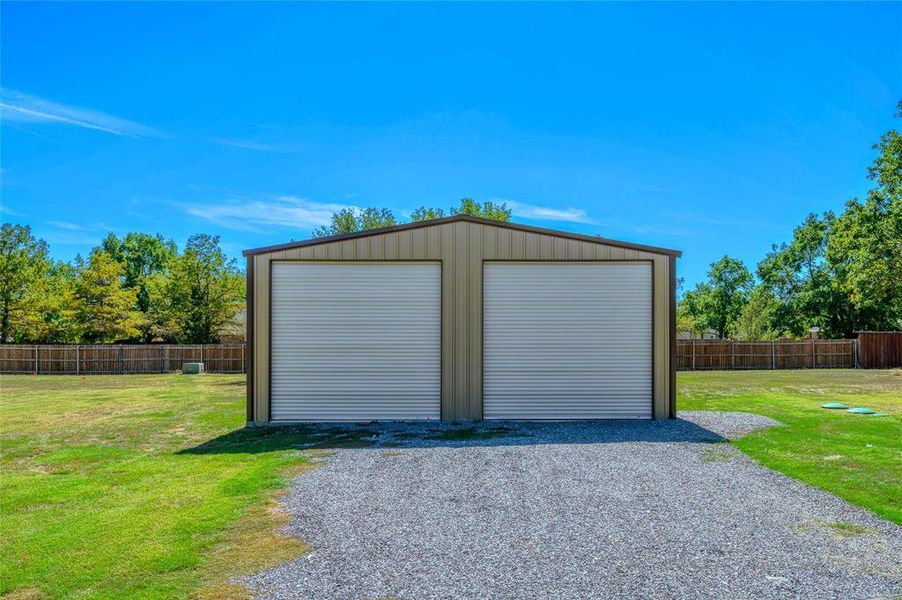 Garage featuring a yard