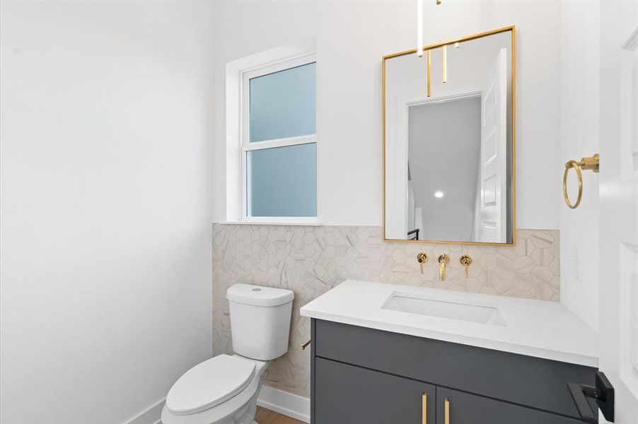 Powder room off of the second floor living area.