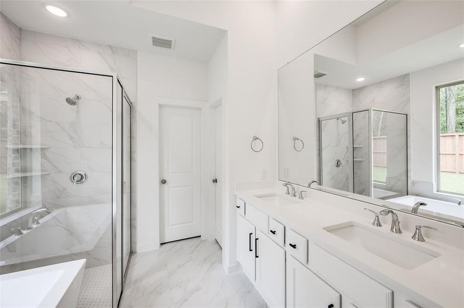 Double sinks and large shower.