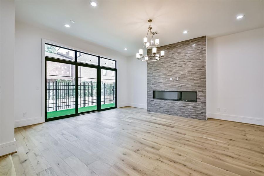 Oversized Family Room features Linear Electric Fireplace