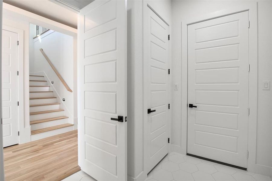 Corridor with light hardwood / wood-style flooring