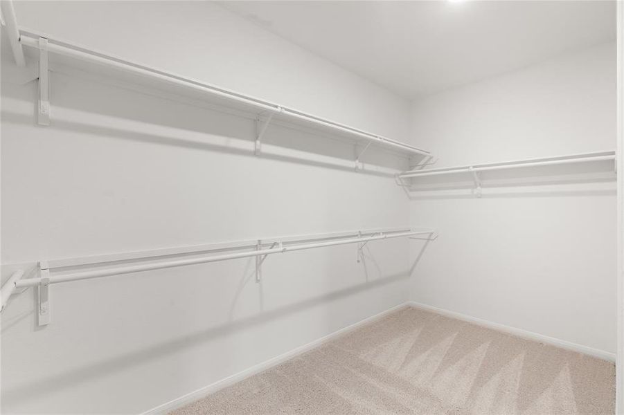 A view of your large primary walk-in closet