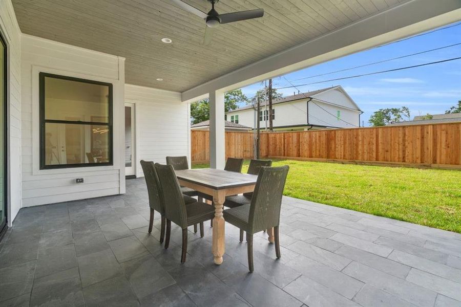 Spacious covered patio with room for dining and seating