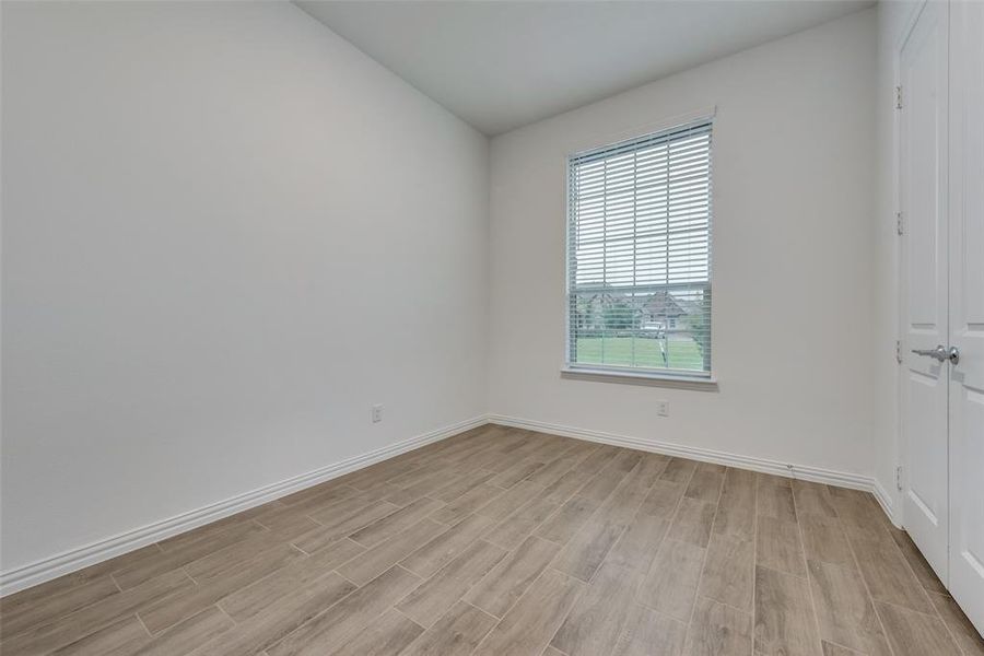 Unfurnished room with light hardwood / wood-style floors