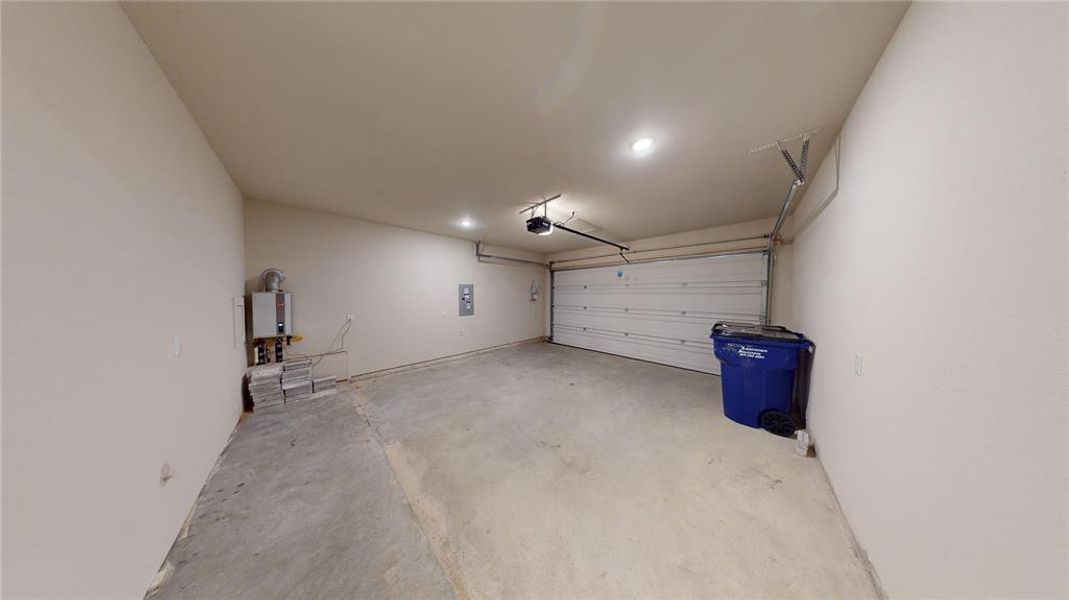 Garage with a garage door opener and tankless water heater