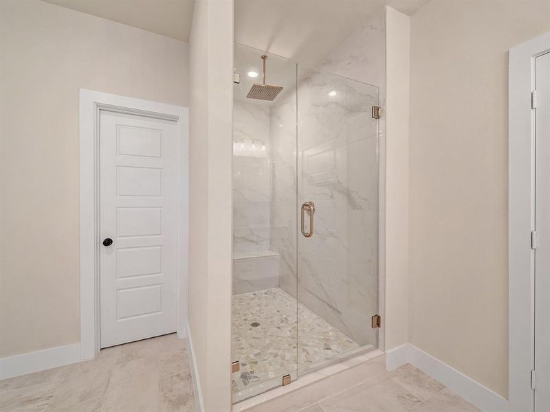 Bathroom featuring a shower with shower door