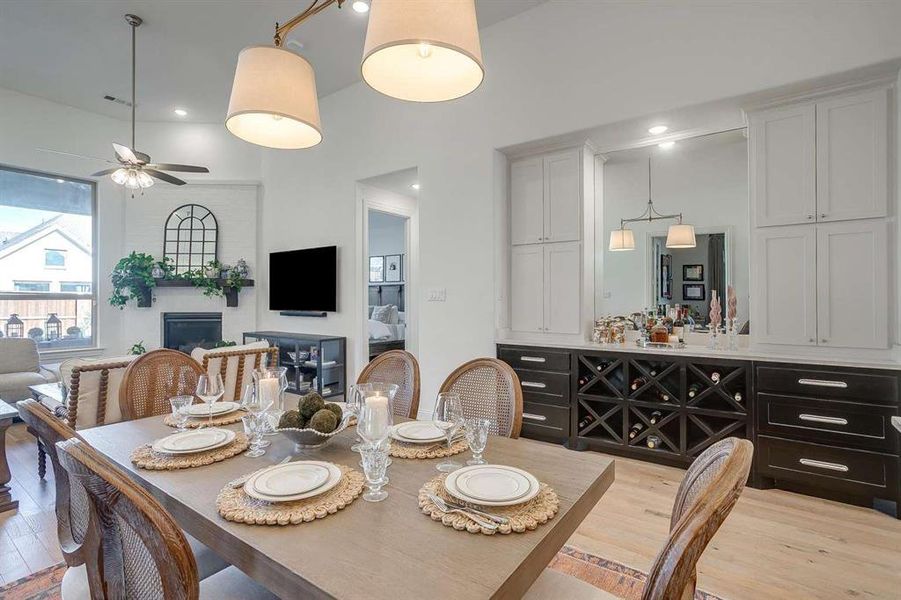 Dining room with ceiling fan and light hardwood / wood-style floors