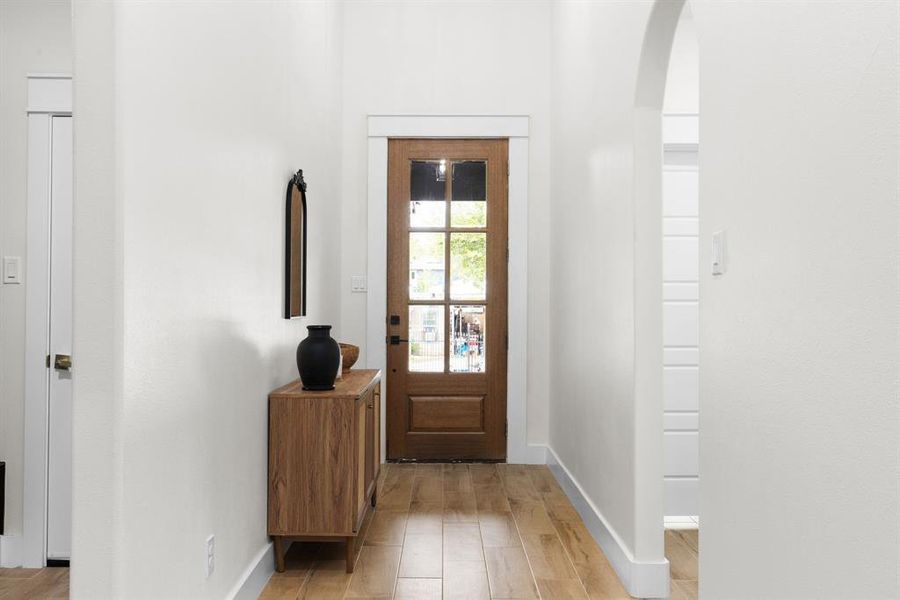 Doorway featuring light wood-type flooring