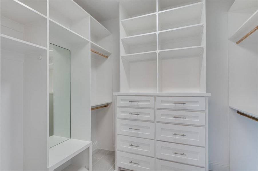 Walk in closet featuring light tile patterned floors