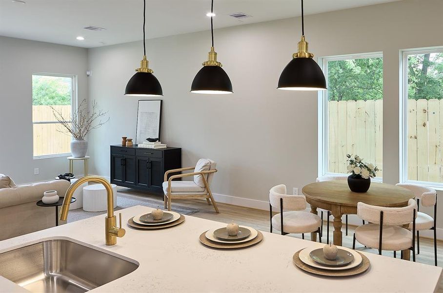 High ceilings throughout the home with elegant pendant lighting and gold finish hardware.