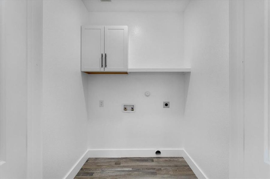 Laundry room with cabinets, gas dryer hookup, hookup for a washing machine, electric dryer hookup, and dark hardwood / wood-style floors