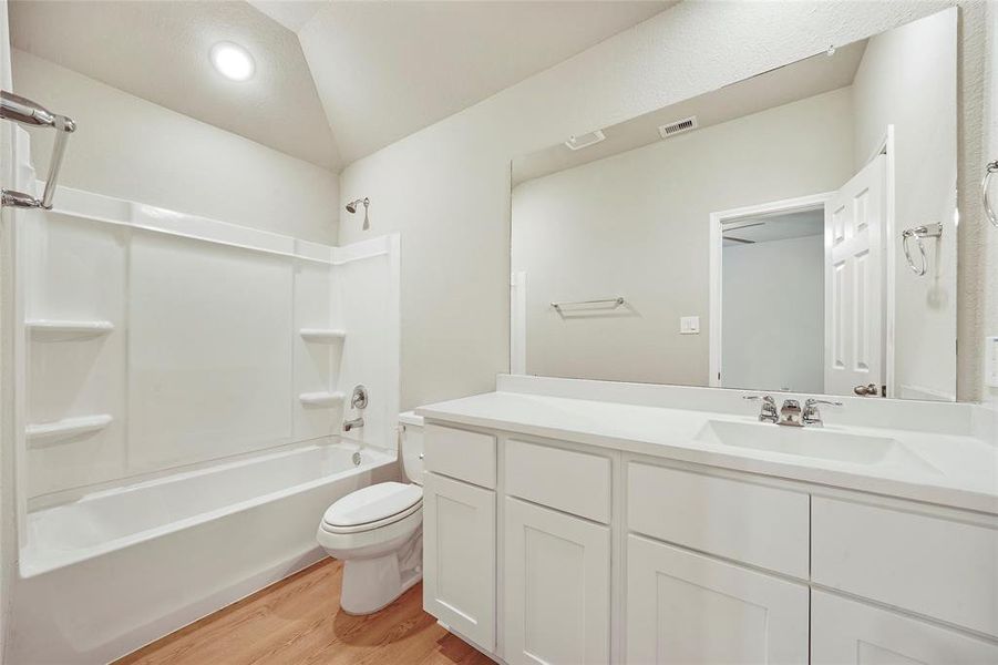 Primary bathroom with tub/shower combo and tons of counter space