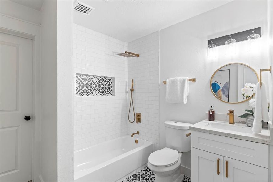 Lovely third full bath connects on one side to your third bedroom with a separate entrance for guests to use as well.