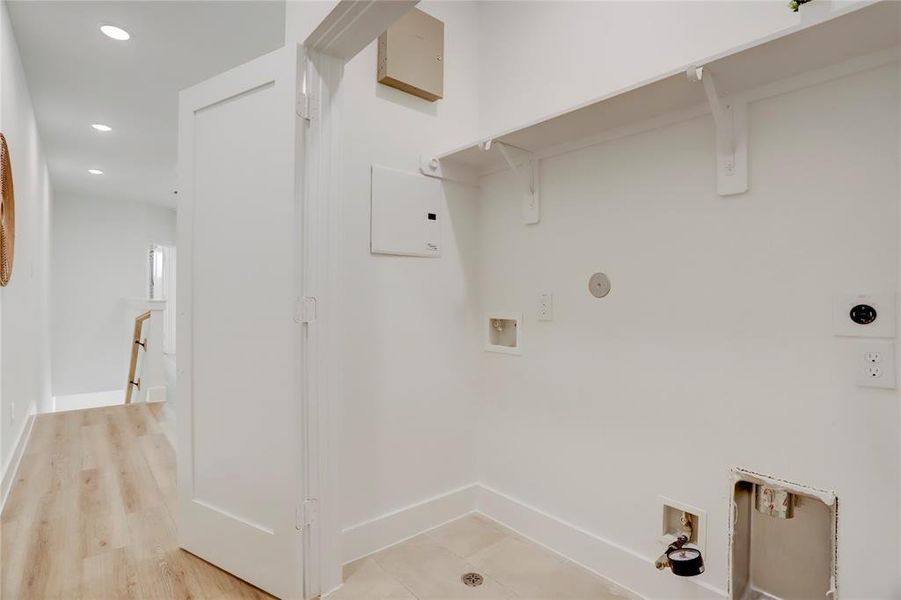 The utility room on the 2nd floor has hook ups for full sized side-by-side washer and dryer.