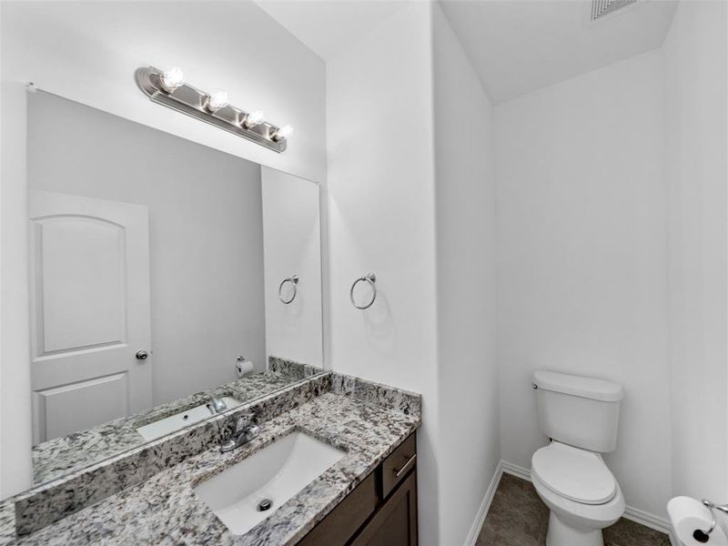 Bathroom featuring toilet and vanity