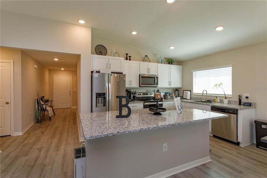 kitchen with stone counter tops and upgrade finishes