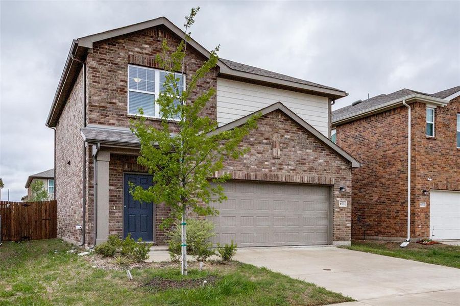 View of front property featuring a garage