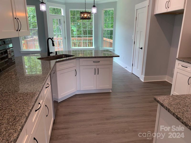 View of kitchen from near hallway between kitchen & DR