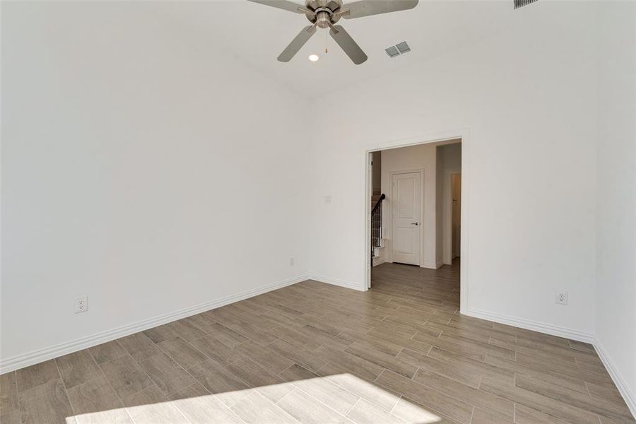 Unfurnished room featuring light hardwood / wood-style floors and ceiling fan