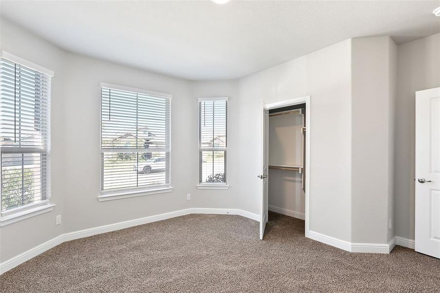 Unfurnished bedroom featuring carpet flooring