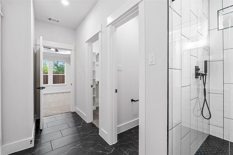 Bathroom featuring tiled shower