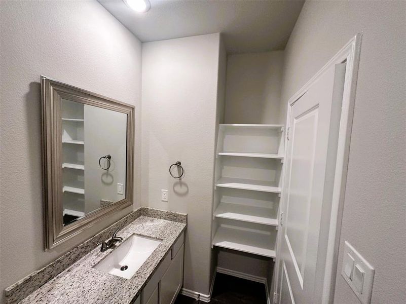 Bath 2 has granite counters & stylish framed mirror!