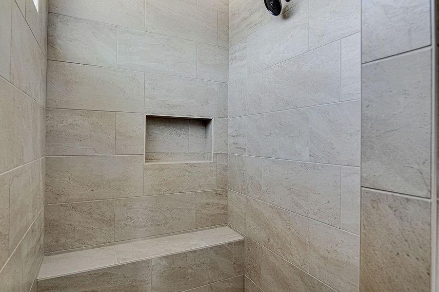 Bathroom featuring a tile shower