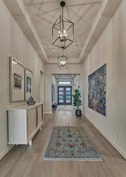 Bright and airy, this spacious home office features elongated windows which invite the soft morning sunlight to illuminate the room. Note the 8' doors throughout this nearly new Perry Home!