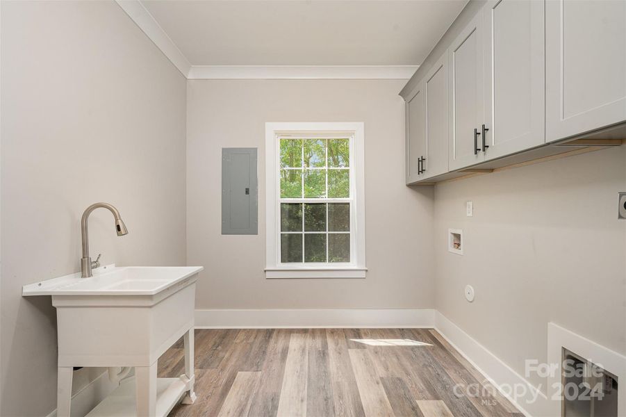 Laundry Room with Utility Sink and Cabinets