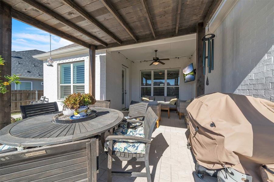 View of patio / terrace with an outdoor hangout area, grilling area, and ceiling fan