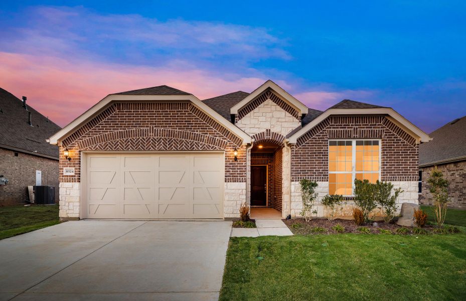 Exterior C with stone and brick, wood shutters, and 2-car garage