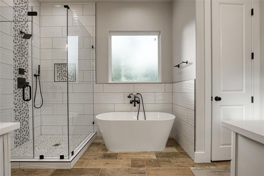 Beautiful large walk in shower and separate soaking tub