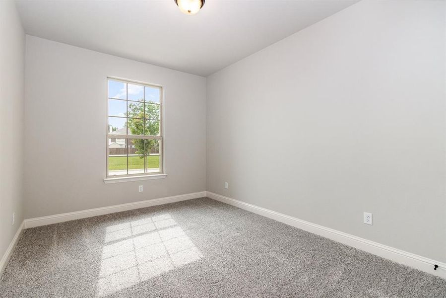 View of carpeted spare room