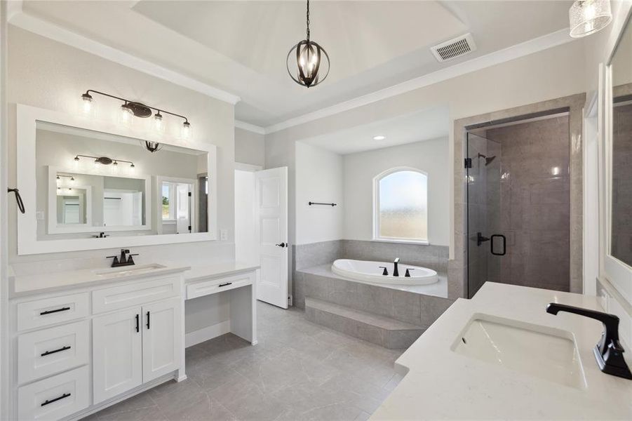 Bathroom with shower with separate bathtub, tile patterned floors, a wealth of natural light, and vanity