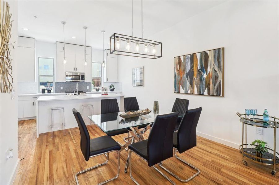 Dining area with light wood-type flooring