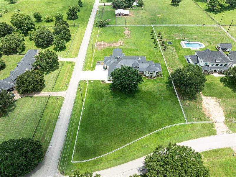 This Luxury Modern Ranch rests on 2 Acres and Features Views of the Neighbors Red Barnand Horses