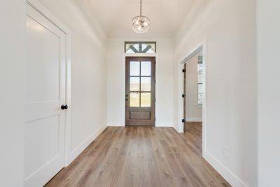 Doorway to outside featuring light hardwood / wood-style flooring