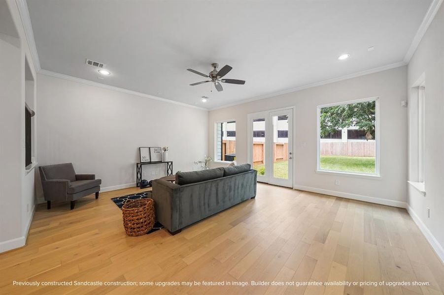 French doors and large windows bring the outside in, offering stunning backyard views.